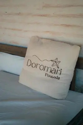 Uma cama ou camas num quarto em Pousada Doromari
