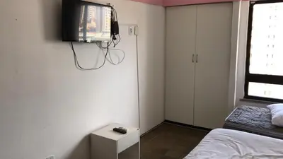 Uma televisão e/ou sistema de entretenimento em 202 Flat mobiliado Praia de Iracema