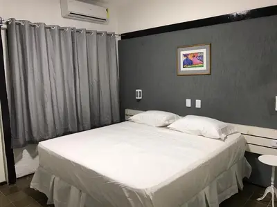 Uma cama ou camas num quarto em 401 Lindo Flat mobiliado Praia de Iracema
