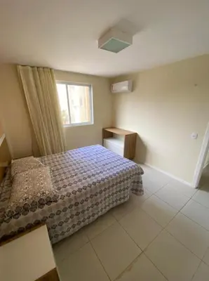 Uma cama ou camas num quarto em TerraMaris Apartamento Beira Mar Pé na areia