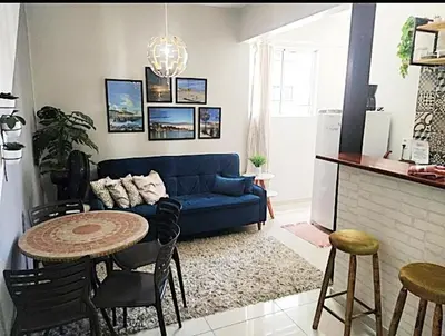 Uma área de estar em Apartamento BEIRA MAR