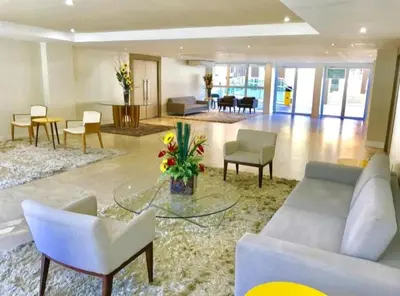 Uma área de estar em JJ ALUGUÉIS TEMPORADA - APTO 1 QUARTO VG FUN PRAIA ao lado do hotel Vila Galé