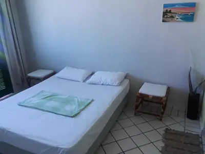 Uma cama ou camas num quarto em Porto Canoa Resort