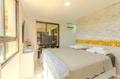 Uma cama ou camas num quarto em Mandara Lanai Apartamento Terreo