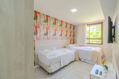 Uma cama ou camas num quarto em Mandara Lanai Apartamento Terreo