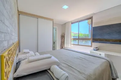 Uma cama ou camas num quarto em Mandara Lanai Apartamento Terreo