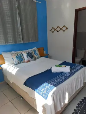 Uma cama ou camas num quarto em Hospedaria da Praia Fortaleza