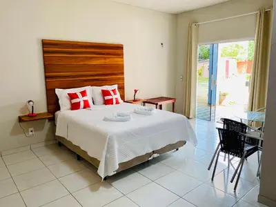 Uma cama ou camas num quarto em Pousada Carmela
