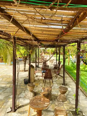 Um jardim no exterior de Pousada Carmela