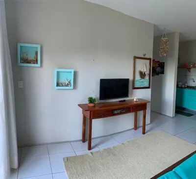 Uma televisão e/ou sistema de entretenimento em Lindo Flat Na Paradisíaca Praia da Taíba