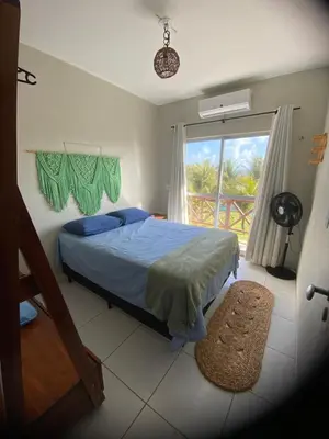 Uma cama ou camas num quarto em Lindo Flat Na Paradisíaca Praia da Taíba