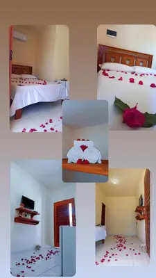 Uma cama ou camas num quarto em Suíte das flores em Guajiru