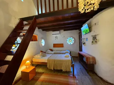 Uma cama ou camas num quarto em Pousada JeriMagia