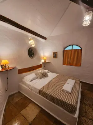 Uma cama ou camas num quarto em Pousada JeriMagia
