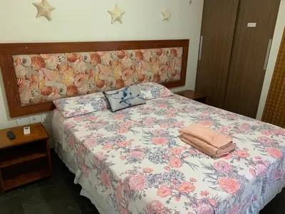 Uma cama ou camas num quarto em Cumbuco Eco Paradise apto com varanda