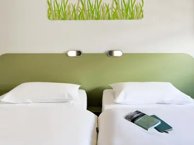 Uma cama ou camas num quarto em Ibis Budget Fortaleza Praia de Iracema