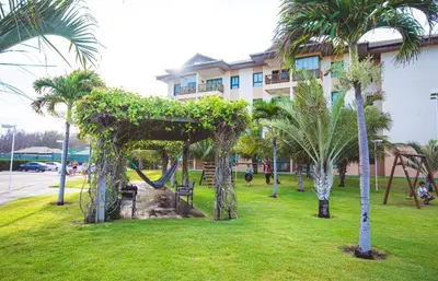 Um jardim no exterior de VG SUN Cumbuco AP304