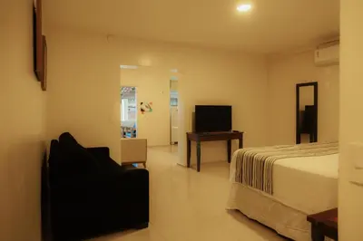 Uma televisão e/ou sistema de entretenimento em Sunset Beach Taíba Hotel