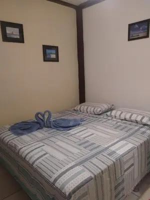 Uma cama ou camas num quarto em Benu Suítes
