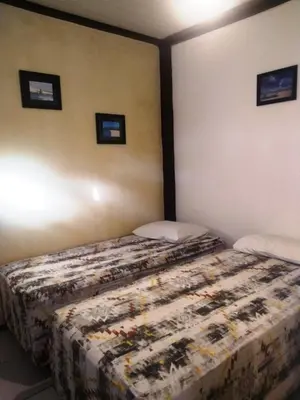 Uma cama ou camas num quarto em Benu Suítes