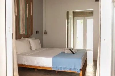 Uma cama ou camas num quarto em Casa Katu