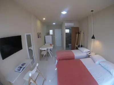Uma cama ou camas num quarto em Flats Taiba Praia Centro