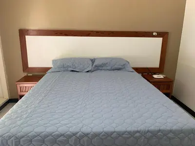 Uma cama ou camas num quarto em Condomínio com vista para o Mar e Piscina no CUMBUCO- AP 106