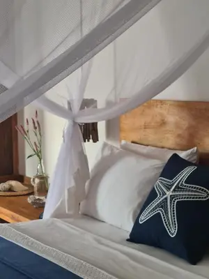 Uma cama ou camas num quarto em Villa Água de Côco Preá