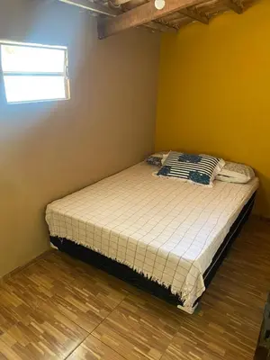 Uma cama ou camas num quarto em Casa Friozinho da serra