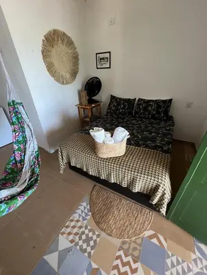 Uma cama ou camas num quarto em Pousada Vila Matury