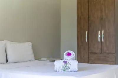 Uma cama ou camas num quarto em Praieiro pousada