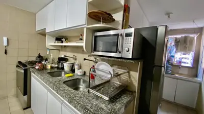 A cozinha ou kitchenette de Apartamento vista mar, 2 Suítes, WC Social,2 vagas