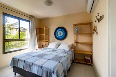 Uma cama ou camas num quarto em VG Sun Cumbuco Resort a Beira Mar Nascente Sombra e Ventilação C1-207