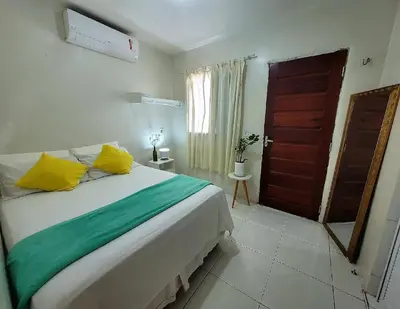 Uma cama ou camas num quarto em Teto Hospedagens Va