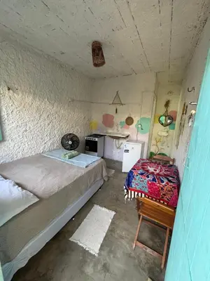 Uma cama ou camas num quarto em Hostel Flor da Vida