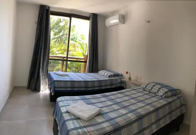 Uma cama ou camas num quarto em Apt Aconchegante no Wai Wai na praia de Cumbuco