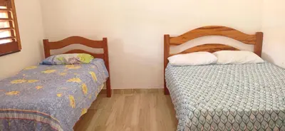Uma cama ou camas num quarto em Casa Tropicana
