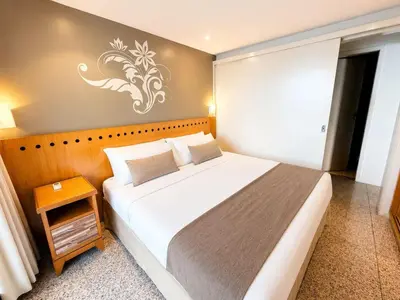 Uma cama ou camas num quarto em Hosts BR - Flat de Frente para o Mar na Beira Mar