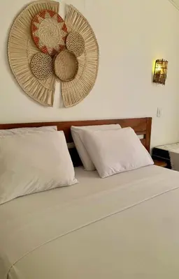 Uma cama ou camas num quarto em Pousada Borboleta