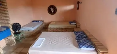 Uma cama ou camas num quarto em Flat Casa Taiba 2002