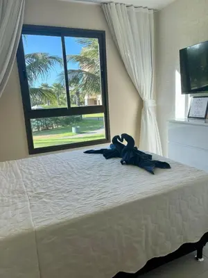 Uma cama ou camas num quarto em VG SUN Cumbuco 1 Quarto
