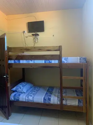 Uma cama ou camas num quarto em Pousada do Ary