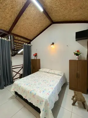 Uma cama ou camas num quarto em Casa de Serra Guaramiranga
