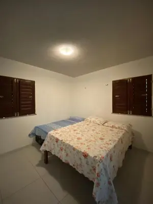 Uma cama ou camas num quarto em Casa de Serra Guaramiranga