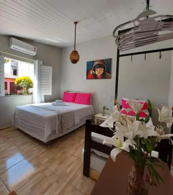 Uma cama ou camas num quarto em Na Casa Delas Jericoacoara