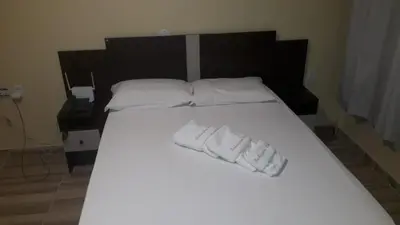 Uma cama ou camas num quarto em 106 Flat mobiliado na Praia de Iracema
