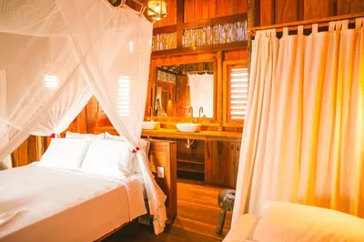 Uma cama ou camas num quarto em Vila Beijú BARRINHA - Frente Mar!