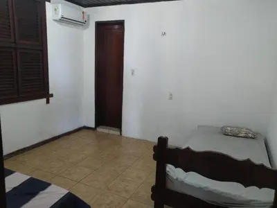 Uma cama ou camas num quarto em Casa de Praia Pecém