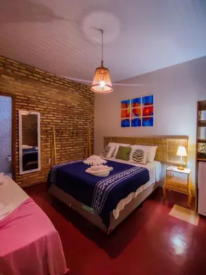 Uma cama ou camas num quarto em Pousada Bella Mar