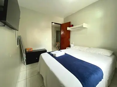 Uma cama ou camas num quarto em Teto Hospedagens